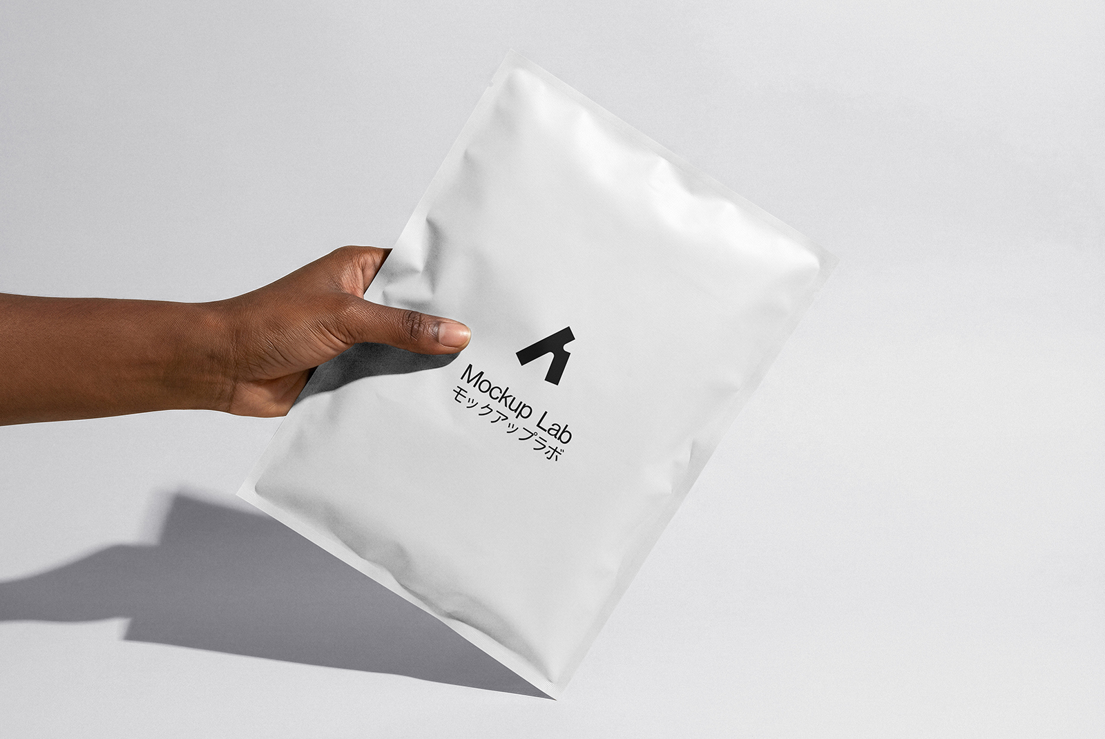 Overhead view of a single packet mockup on a clean background, showcasing the front design.
